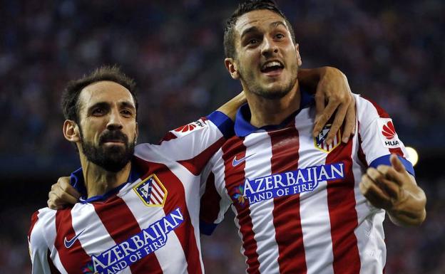 Juanfran y Koke, durante un partido de la temporada 2014-2015. 