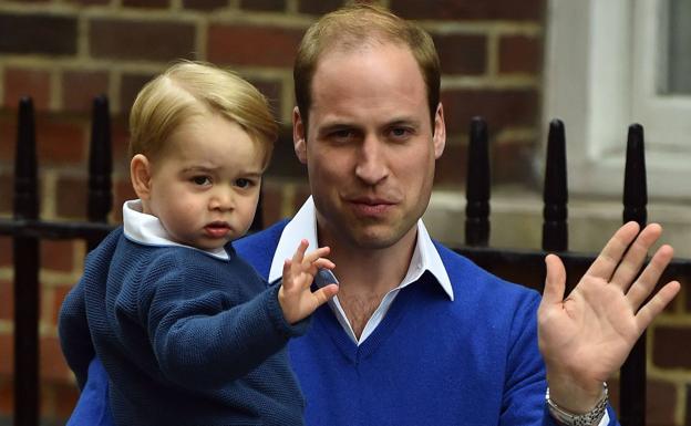 Guillermo, con su hijo George.