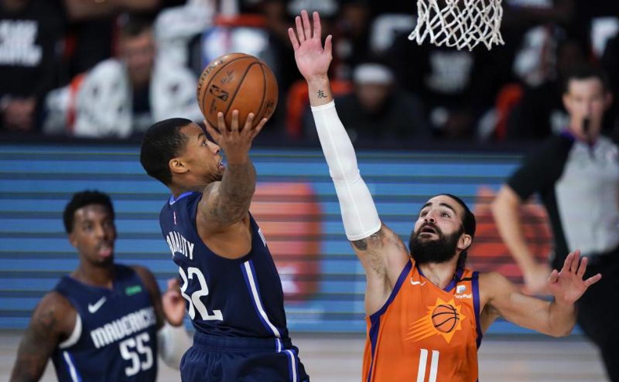 Ricky Rubio intenta taponar a Trey Burke. 