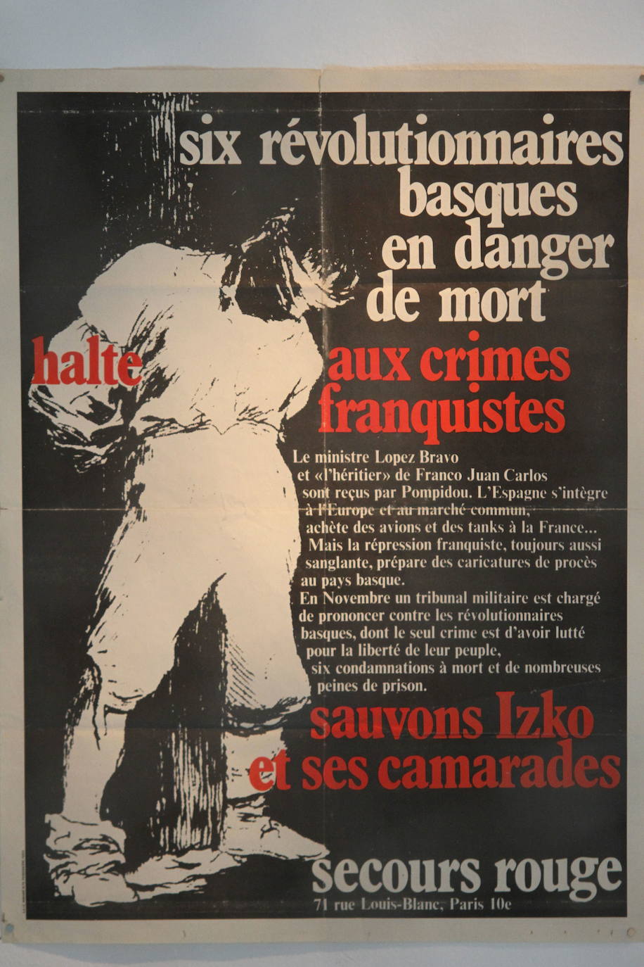 Cartel de Socorro Rojo en el que se lee " Seis revolucionarios de muerto . Alto a los crímenes franquistas, salvemos a Izko y sus camaradas ", sobre el proceso de Burgos de 1970