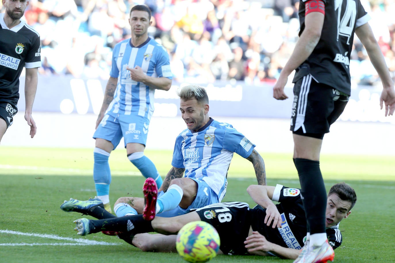 Imágenes del empate entre el Málaga CF y el Burgos CF disputado en La Rosaleda