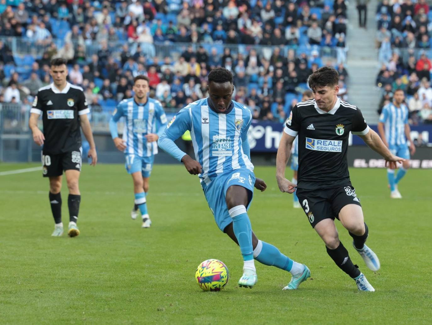 Imágenes del empate entre el Málaga CF y el Burgos CF disputado en La Rosaleda