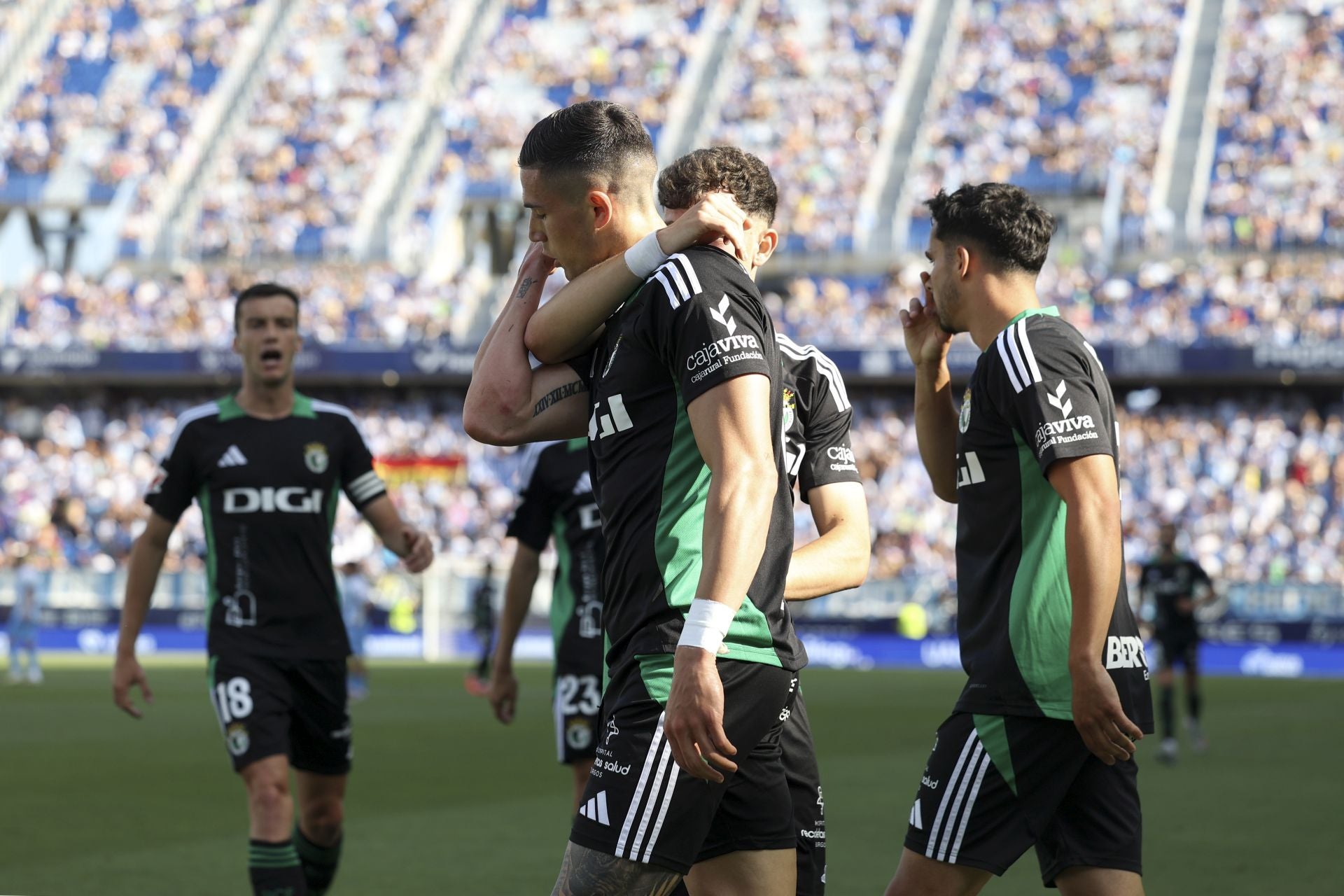 El encuentro del Málaga y del Burgos CF en La Rosaleda, en imágenes