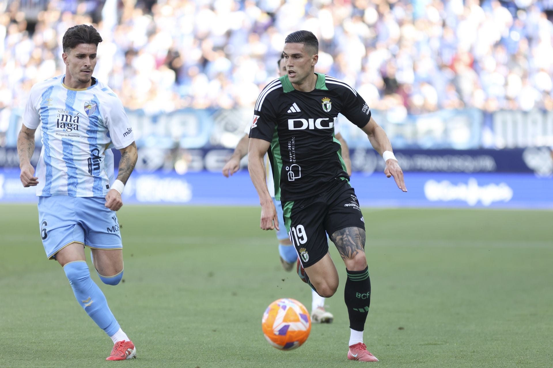 El encuentro del Málaga y del Burgos CF en La Rosaleda, en imágenes
