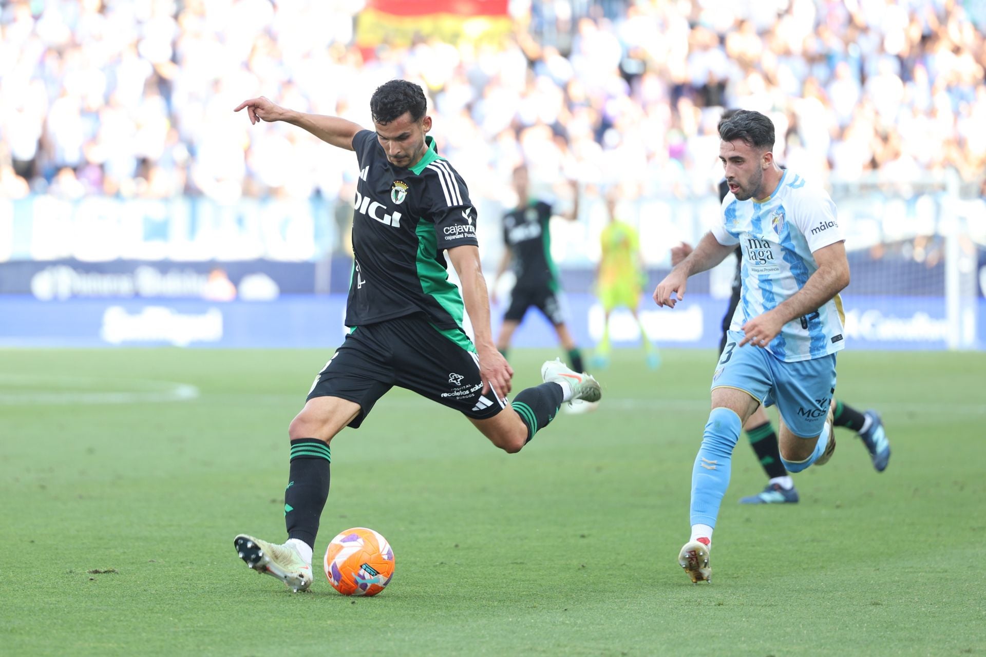 El encuentro del Málaga y del Burgos CF en La Rosaleda, en imágenes