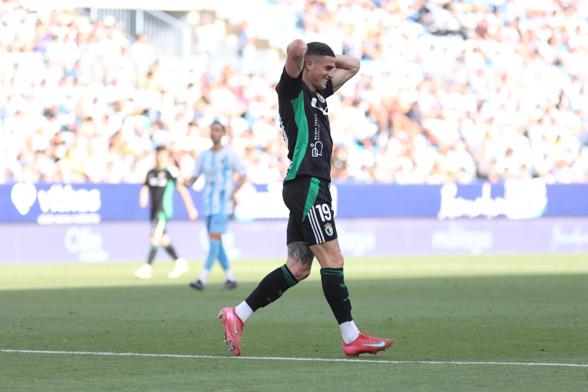 El encuentro del Málaga y del Burgos CF en La Rosaleda, en imágenes