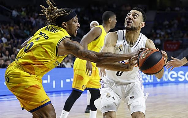 Imagen principal - Imágenes del encuentro entre el Real Madrid y el Gran Canaria. 