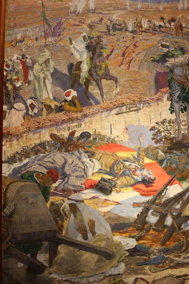 'Los de Igueriben mueren...'. Antonio Muñoz Degrain. 1924. Óleo sobre lienzo.. De más de tres metros de alto por dos de ancho, el lienzo de Muñoz Degrain representa un episodio de la Guerra de Marruecos sucedido en 1921.