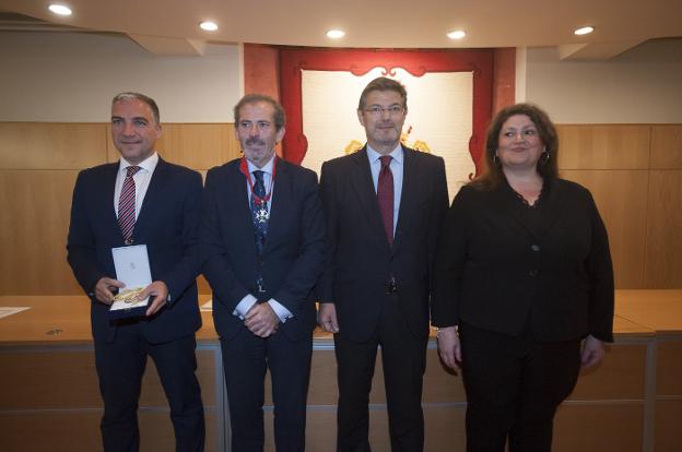 Bendodo, Lara, Catalá y Díaz, durante el acto de ayer en el Colegio de Abogados. :: francis silva