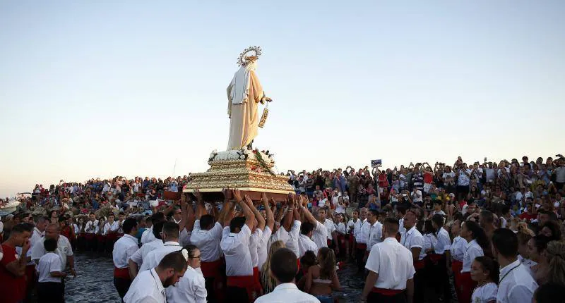 Celebración de la festividad y procesión en El Palo