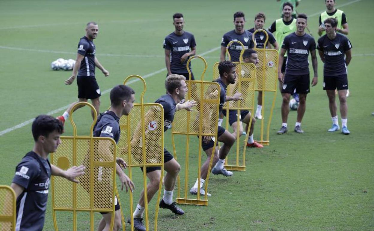 Los jugadores, en el entrenamiento de este viernes. 