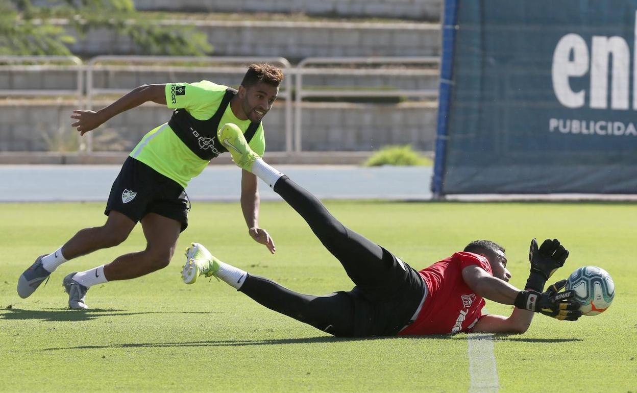 Benkhemassa y Munir, en un entrenamiento. 