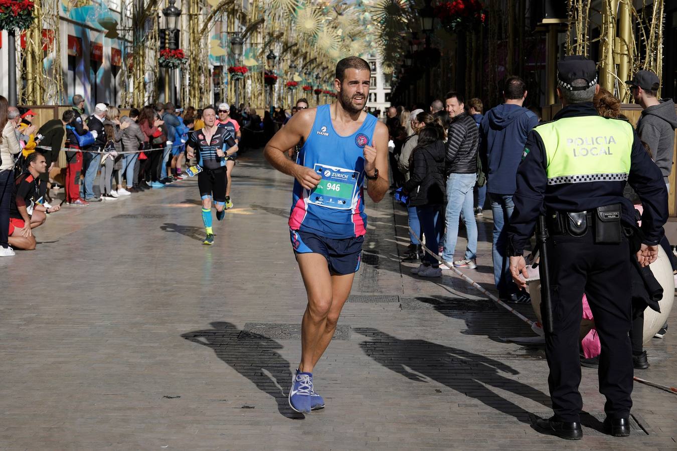 Los corredores, en calle Larios