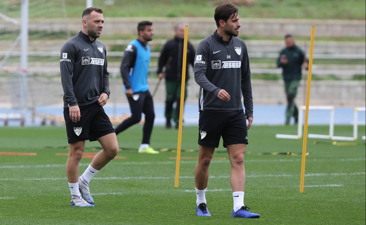 Keidi y Luis Muñoz, en el entrenamiento de hoy en el Ciudad de Málaga. 