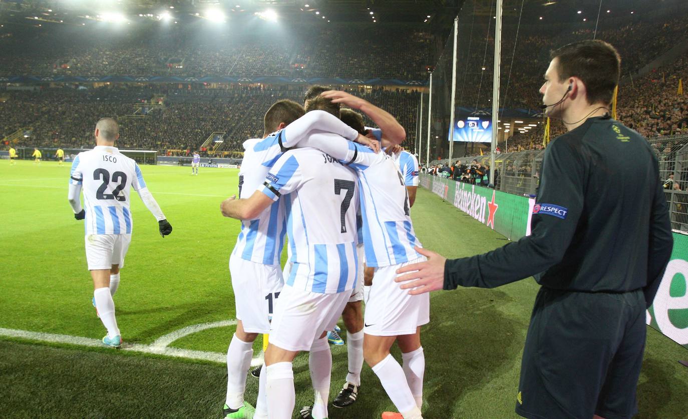 La injusta eliminación del Málaga en la Champions en el campo del Dortmund cumple hoy siete años con las mismas dudas que el primer día. Revive aquel momento foto a foto.