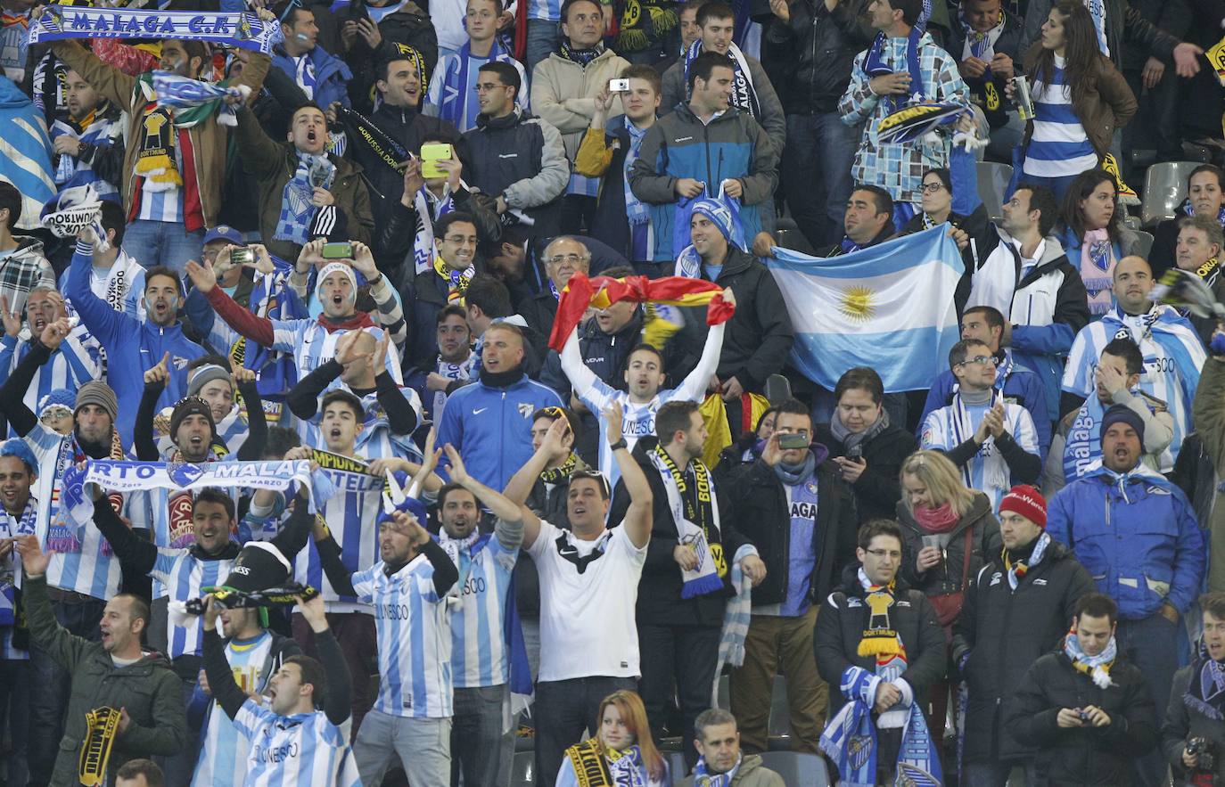 La injusta eliminación del Málaga en la Champions en el campo del Dortmund cumple hoy siete años con las mismas dudas que el primer día. Revive aquel momento foto a foto.