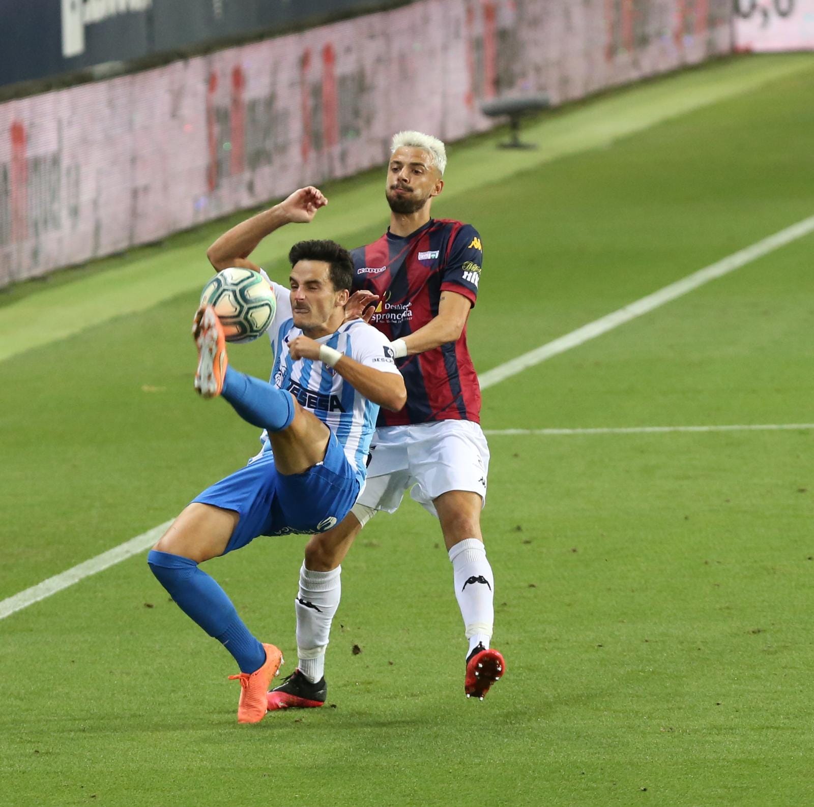 Todos los momentos del partido en imágenes desde La Rosaleda, que por segunda vez abre sus puertas para el fútbol pero sin aficionados en las gradas. 