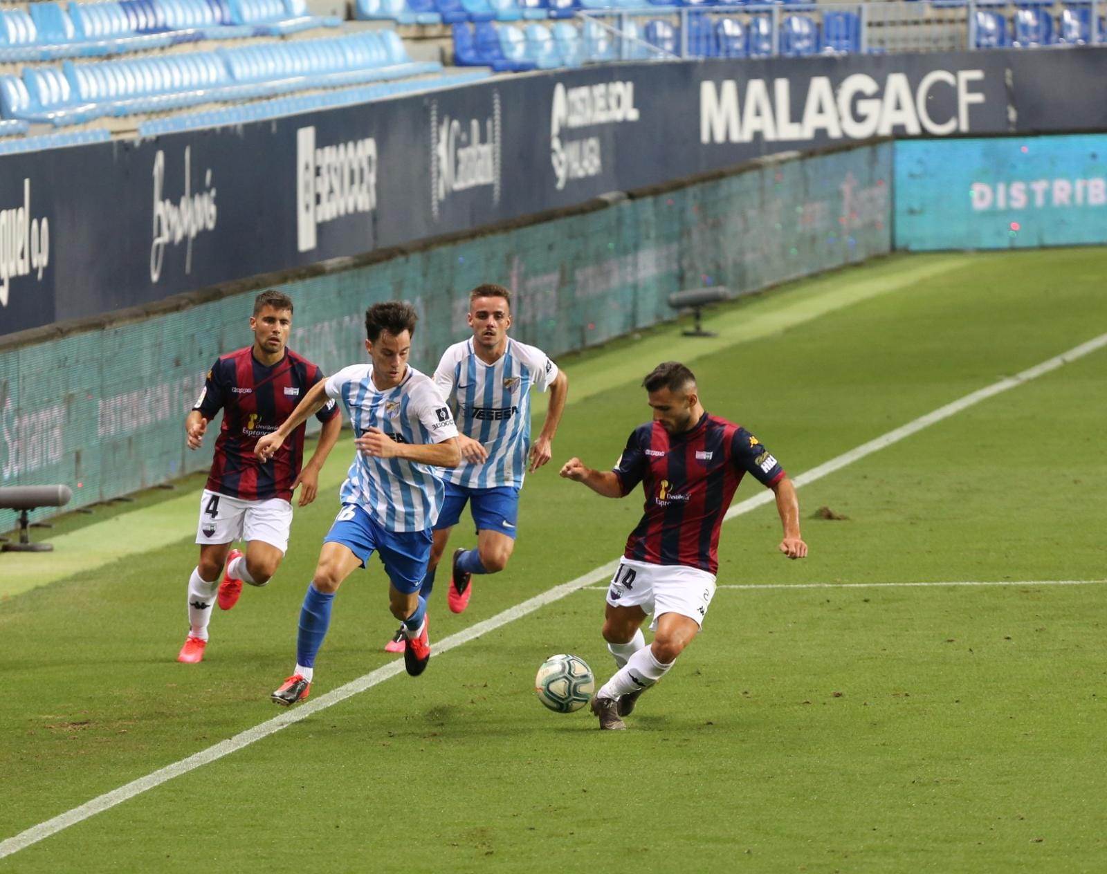 Todos los momentos del partido en imágenes desde La Rosaleda, que por segunda vez abre sus puertas para el fútbol pero sin aficionados en las gradas. 