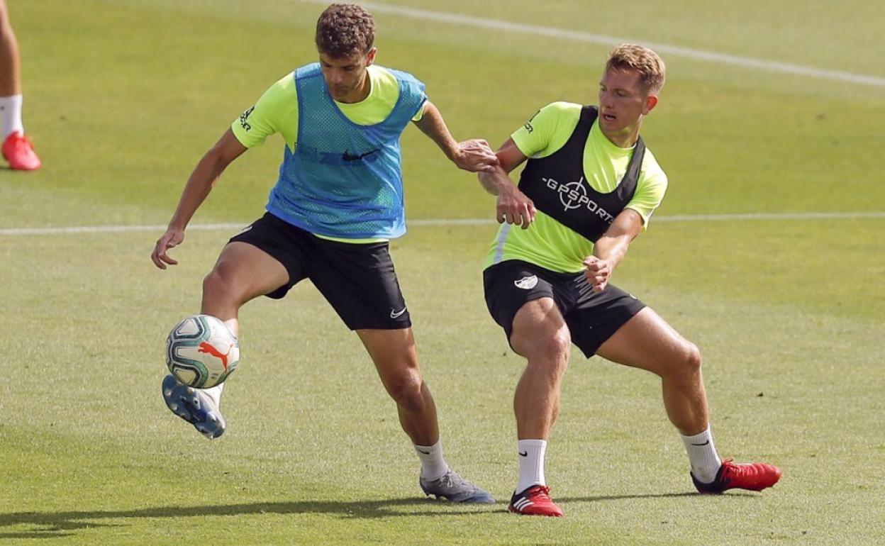 El canterano Quintana juntoa Rolón en el entrenamiento de ayer.