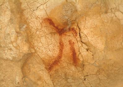 Imagen secundaria 1 - Grupo visitando la Cueva de Ardales. Abajo, representación de una cabra en la Cueva del Higuerón y página dedicada a la Cueva de Ardales en la revista L'Anthropologie.