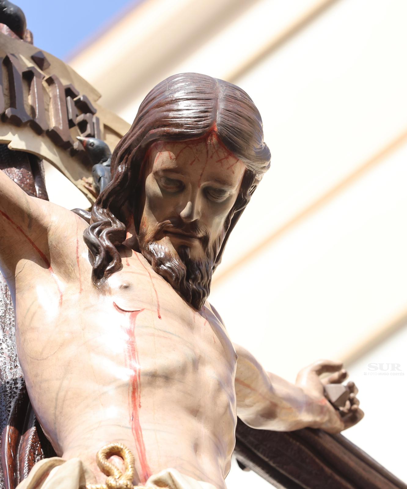 Las mejores imágenes de las cofradías del Viernes Santo en Málaga. Procesionan Monte Calvario, Descendimiento, Dolores de San Juan, Amor, Traslado, Piedad, Sepulcro y Servitas.