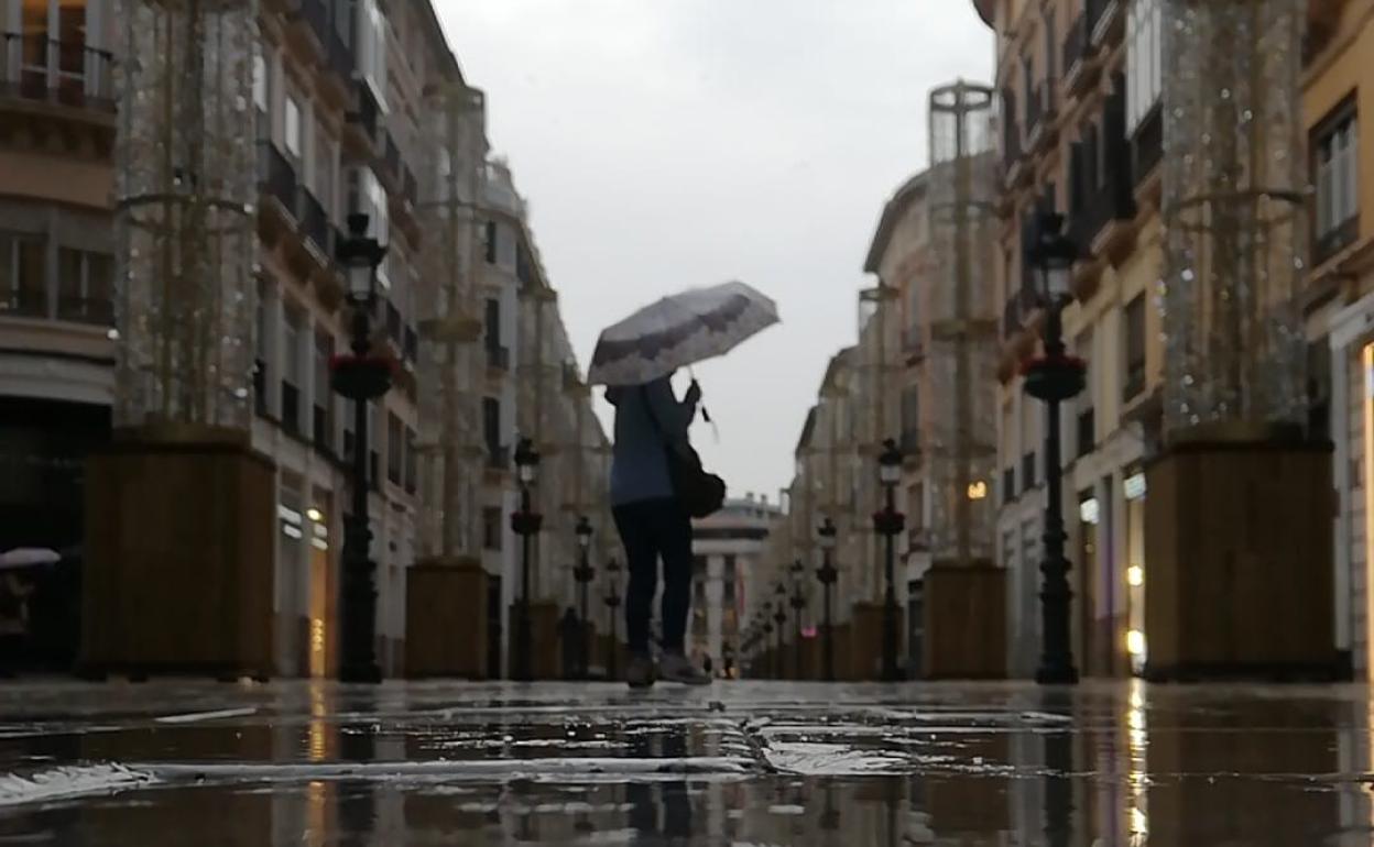 La calle Larios de Málaga, casi desierta por la lluvia. 