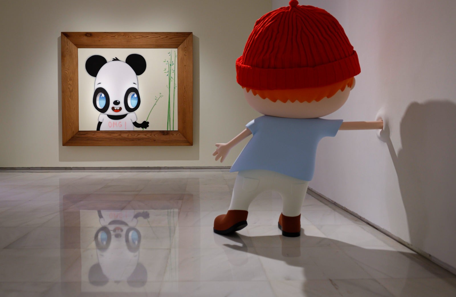 'No art here', escultura de aluminio incrustada sobre la pared, con lienzo OMG! 