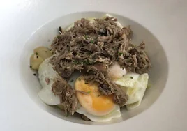 El plato de huevos con chivo malagueño de Anfitrión.