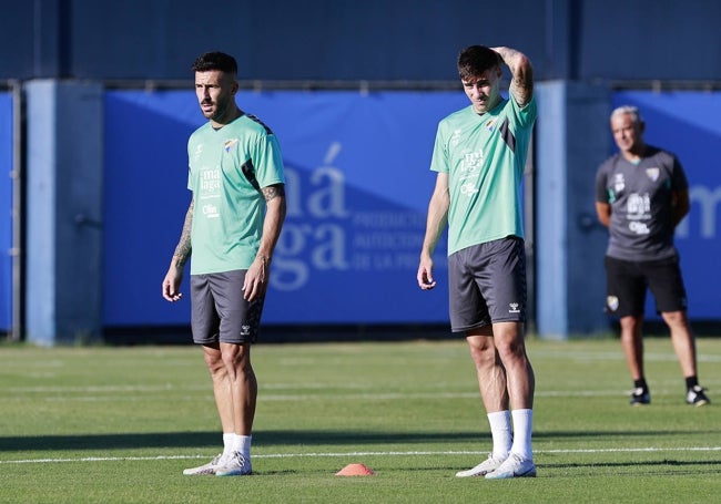 Dioni y Roberto, con Pellicer detrás, en la sesión de este lunes.