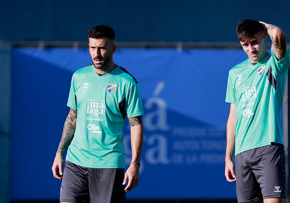 Dioni, en un entrenamiento, con Roberto a su derecha.