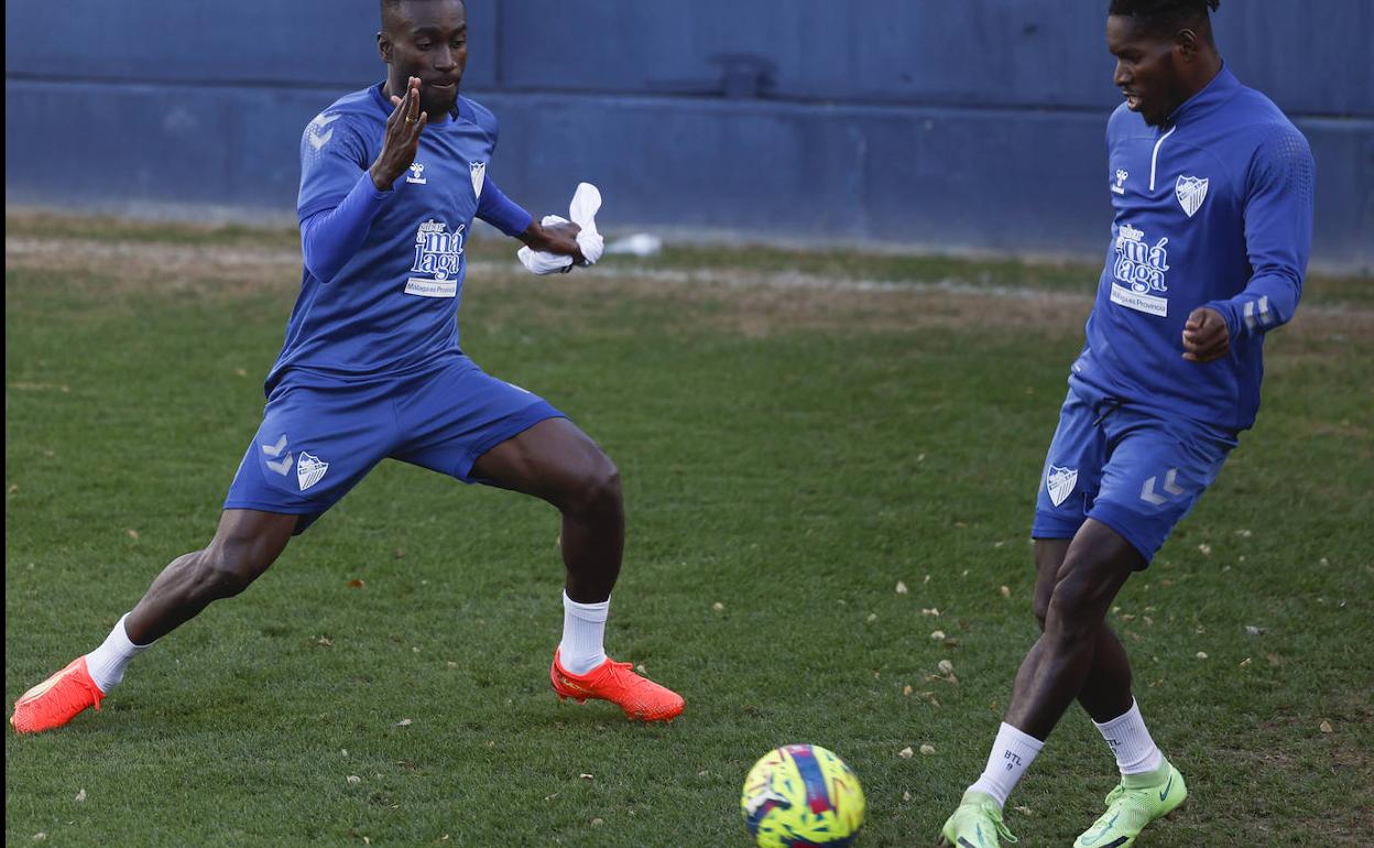 Lumor, a la derecha, junto a Lago Junior en un entrenamiento. 