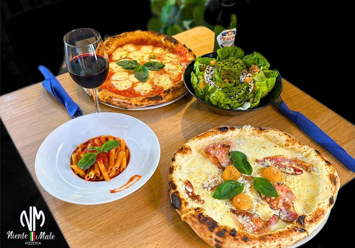 Niente Male Pizzeria ofrece una cuidada aproximación a la cocina tradicional italiana, con especial protagonismo de sus pizzas.