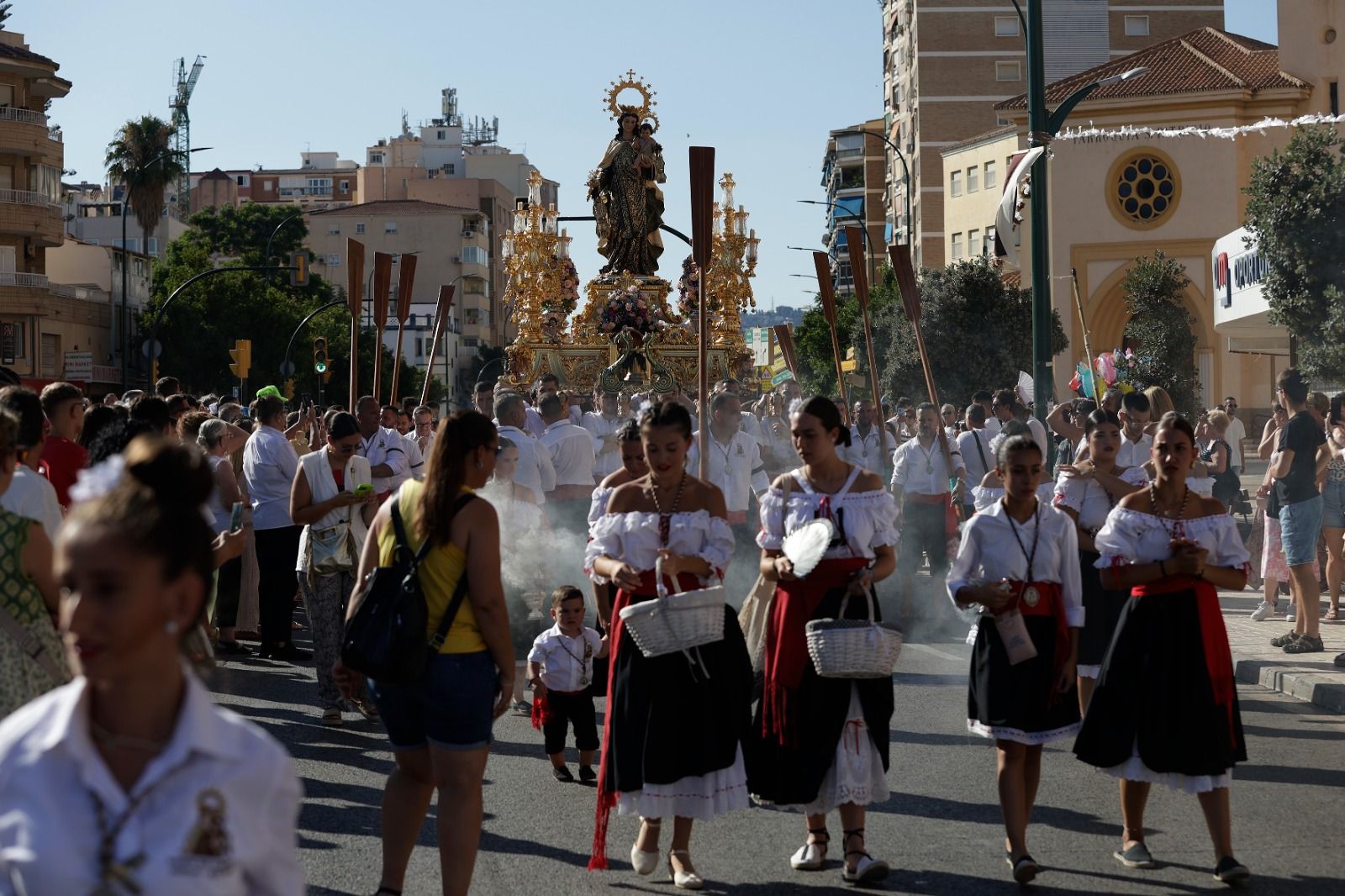 La procesión de la Virgen del Carmen de Huelin, en imágenes