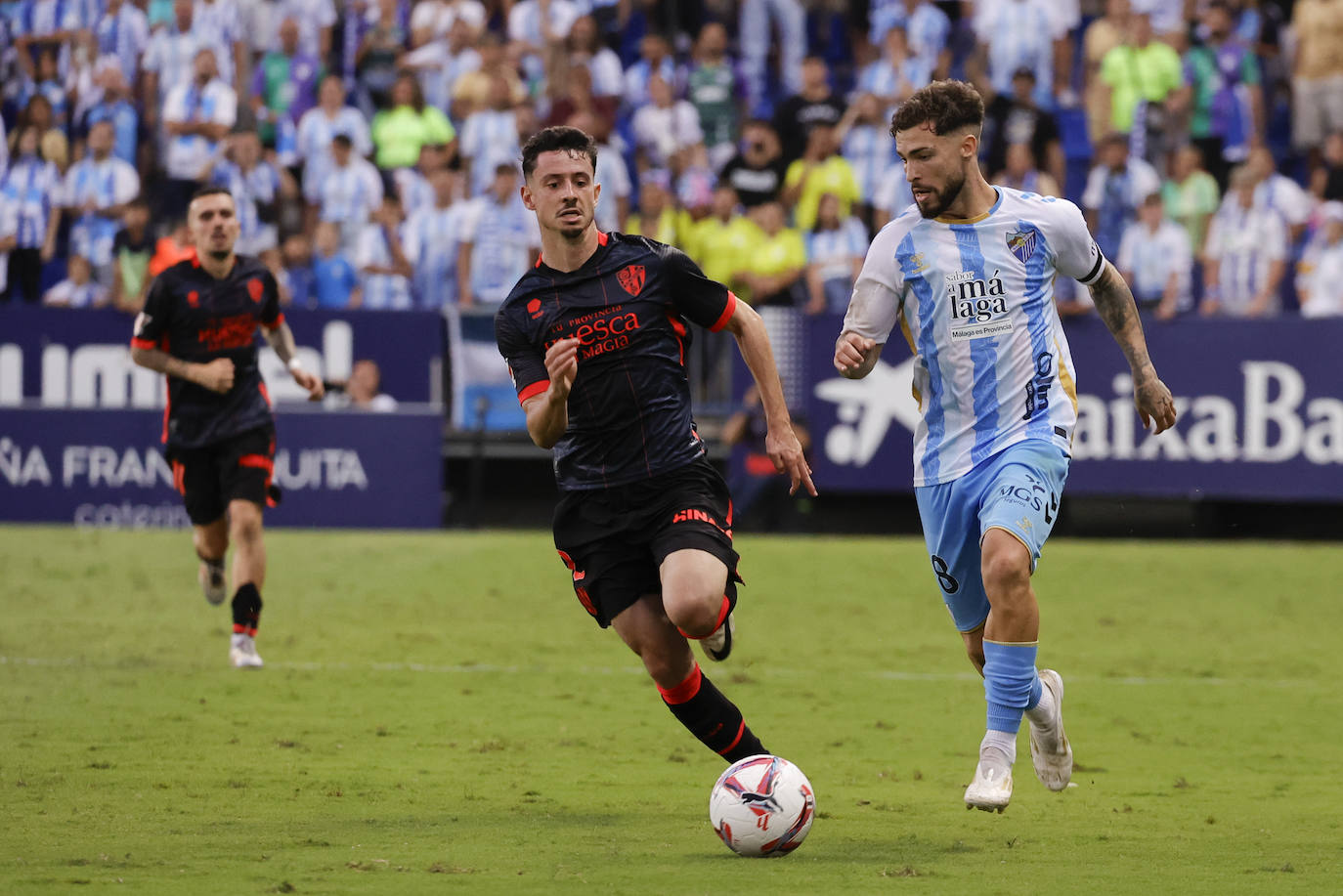 El Málaga-Huesca, en imágenes