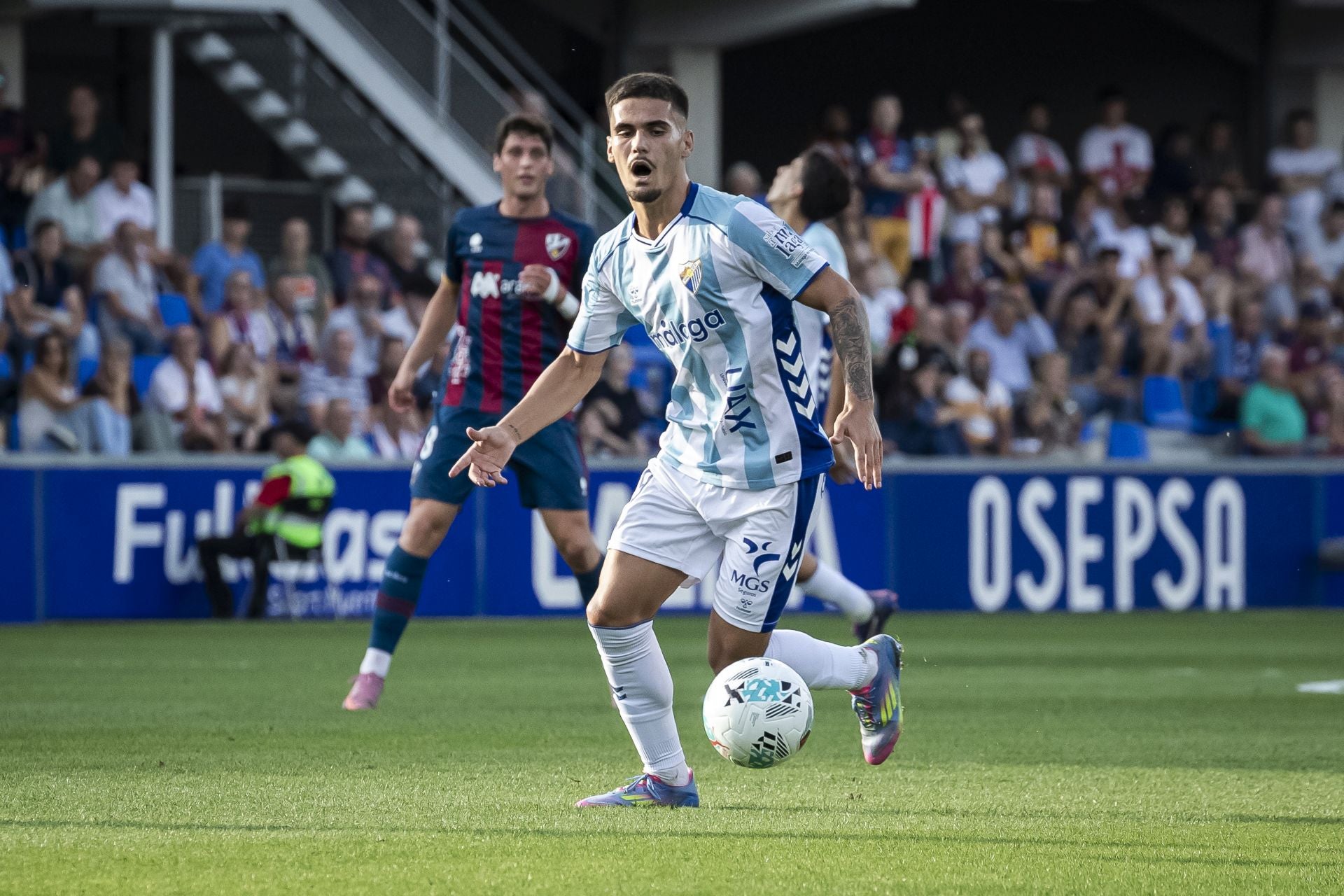 El Huesca- Málaga, en imágenes