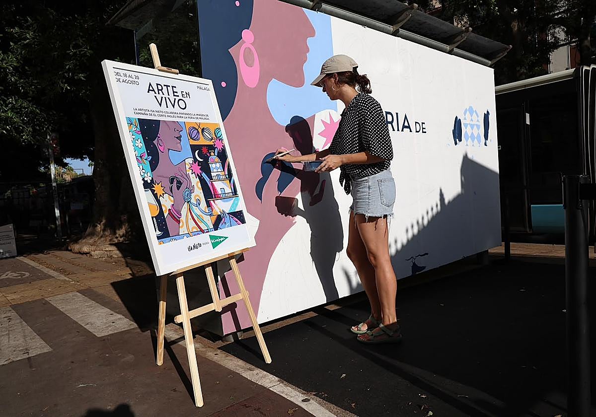 Isa Nieto pinta en directo en la Alameda su cartel para la Feria de Málaga
