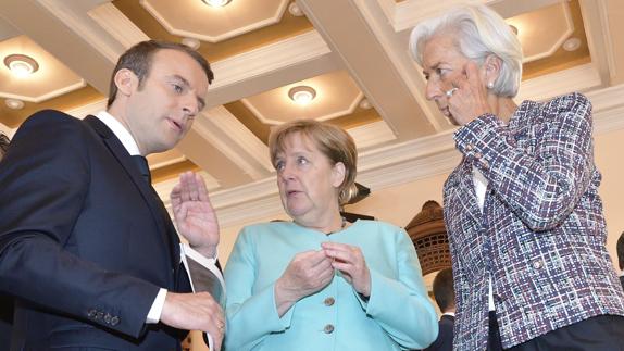 Macron, Merkel y Lagarde.