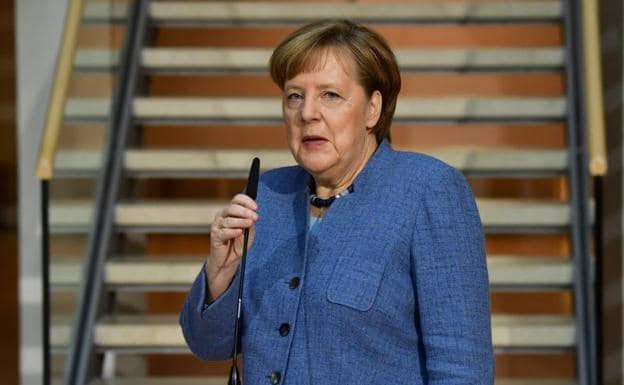 Angela Merkel, durante una comparecencia a su llegada a la sede del SPD.