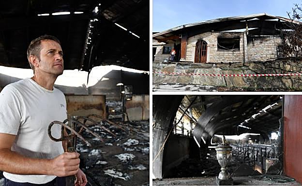 Joxe Manuel Etxeberria mira al fondo de uno de los pabellones en los que alimentaba y guardaba su rebaño y que quedó calcinado tras el incendio. 
