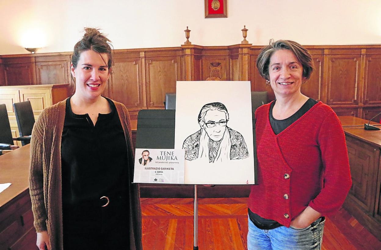 Concejal y técnica de Euskera junto a la obra ganadora. 