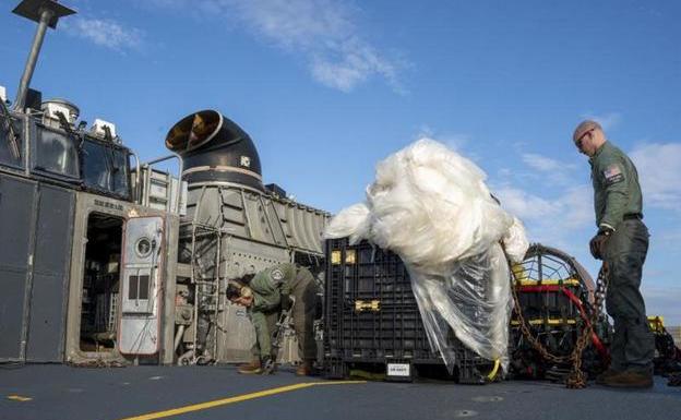 Members of the Navy prepare the shipment of a balloon shot down on February 10 in the Atlantic Ocean to be analyzed by federal agents