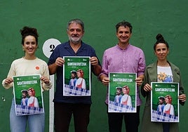 Ainhoa Salaberria, Jon Legorburu, Mikel Arruti y Eneritz Arruti con el cartel de las Santakrutz jaiak de este año.
