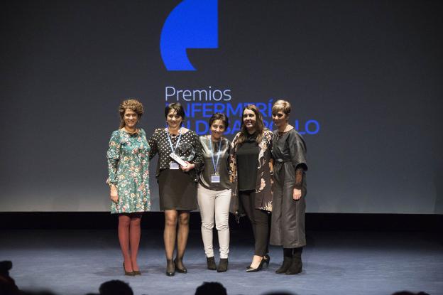 María José Rey, segunda por la izquierda, junto con el resto de su equipo, en Madrid. 