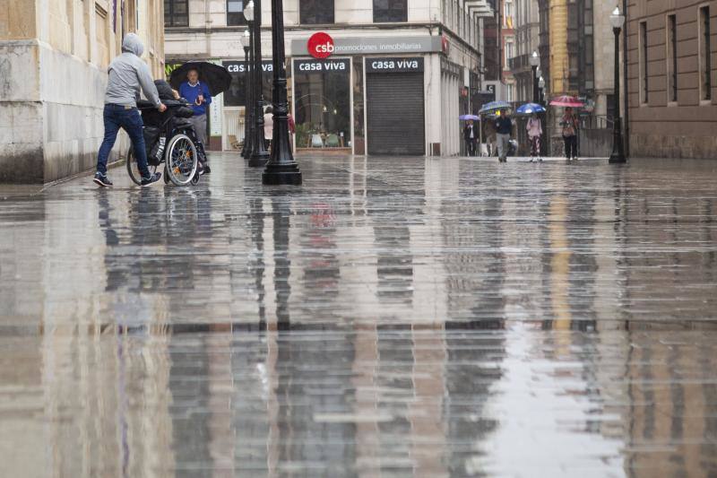 Fotos: Temperaturas otoñales y de intensas lluvias en Asturias