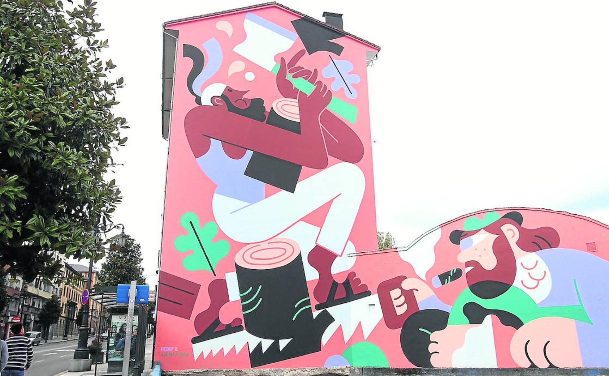 Dos fachadas de La Tenderina rinden homenaje a los deportes tradicionales de fuerza asturianos..