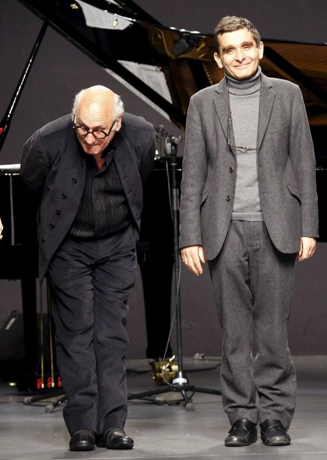 Adolfo Domínguez acompañado por el músico británico ichael Nyman en la presentación de su colección de otoño-invierno en la 51 edición de la Cibeles Fashion Week de Madrid.