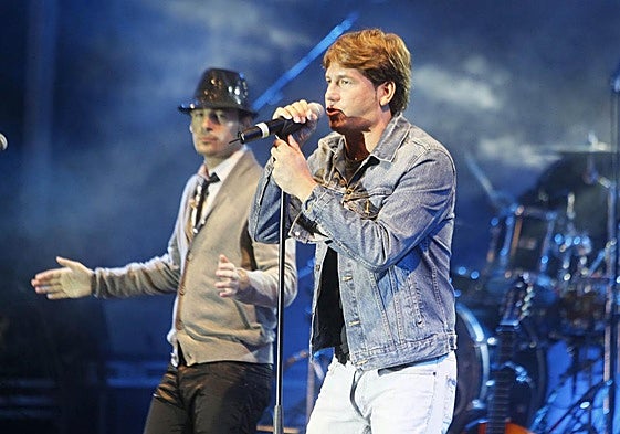 Andy, con sombrero, y Lucas en un concierto.