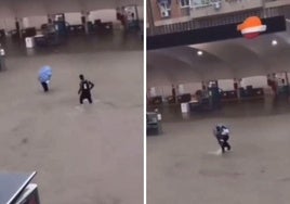 El joven se acerca a la mujer y la lleva fuera de la zona inundada.