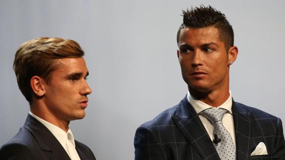 Cristiano y Griezmann en un acto. 