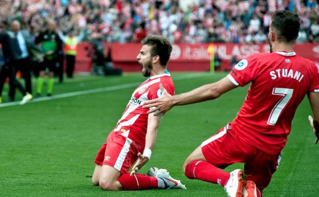 'Portu' (i) y el uruguayo Cristhian Stuani (d) celebran un gol marcado al Sevilla